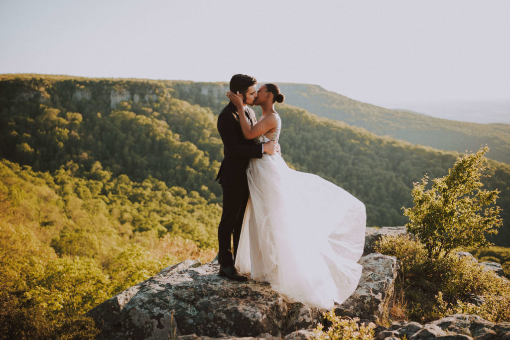 man and woman kissing on mountaintop at mount magazine arkansas -- where to elope in arkansas